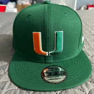 🙌UM Green Snapback Cap with Orange and Green Logo